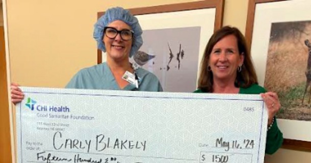 Carly Blakely, RN (left) was recently awarded a $1,500 Health Care Career Scholarship from CHI Health Good Samaritan’s Foundation Director Cindi Richter (right). Blakely, a registered nurse in the hospital’s operating room, was one of 26 recipients of the annual scholarship program made possible by generous donors.