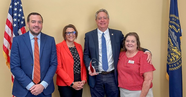 AARP Nebraska’s Jina Ragland, Associate State Director of Advocacy and Outreach, and Suzan DeCamp, Volunteer State President, gather with Senator Robert Dover and Eric Gerrad of ACG, Inc. for the inaugural Community Fraud Fighter Award presentation. 